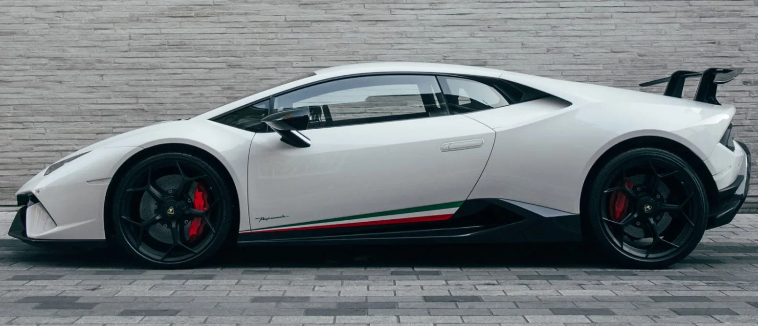 Side view of AZ Luxe's white Lamborghini Huracan Performante in London