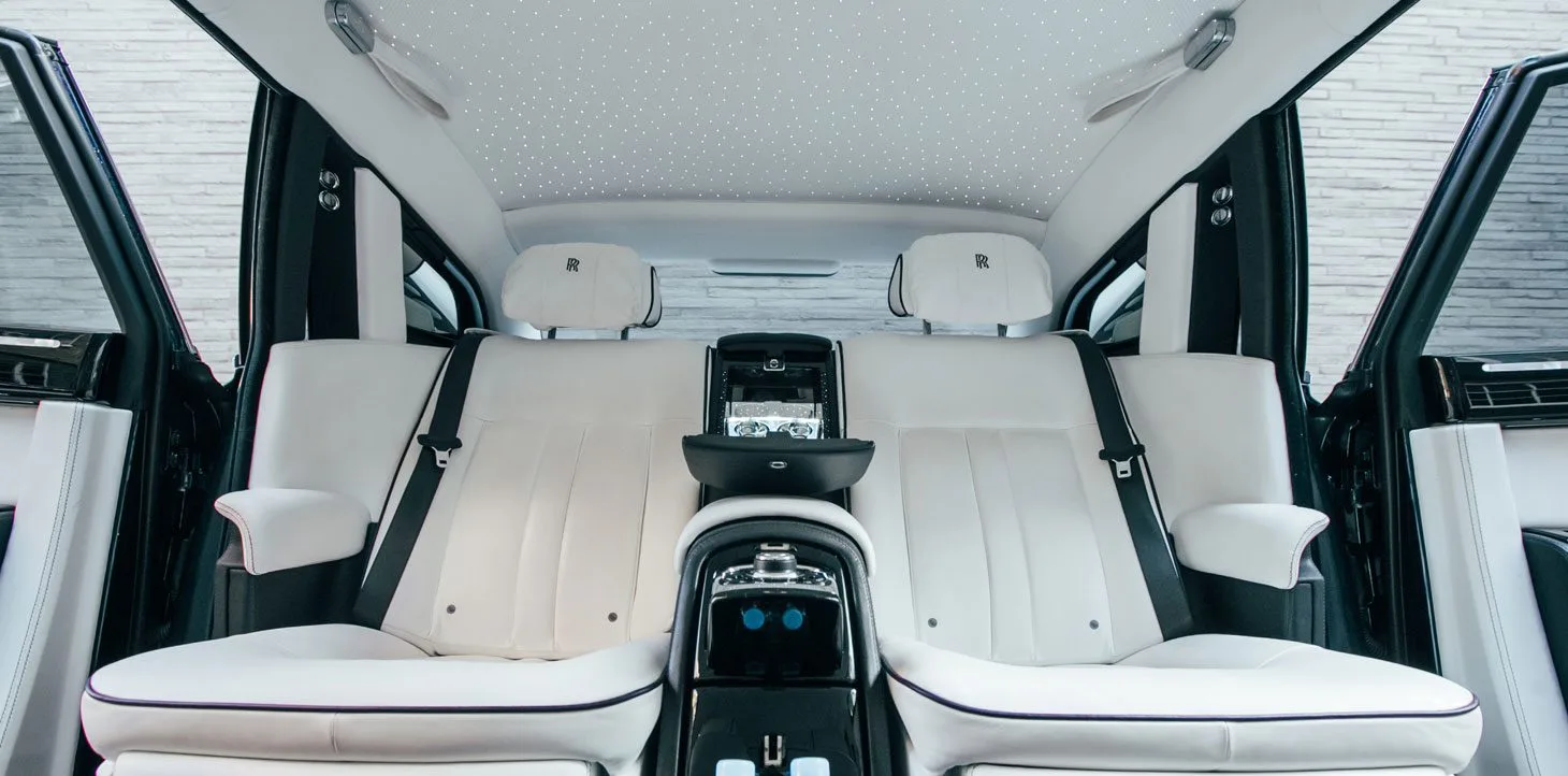 Plush white rear seats in AZ Luxe's Rolls Royce Ghost