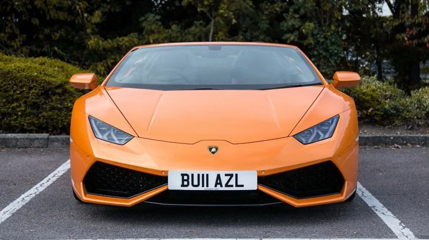 Sporty orange Lamborghini Huracan Spyder available from AZ Luxe London