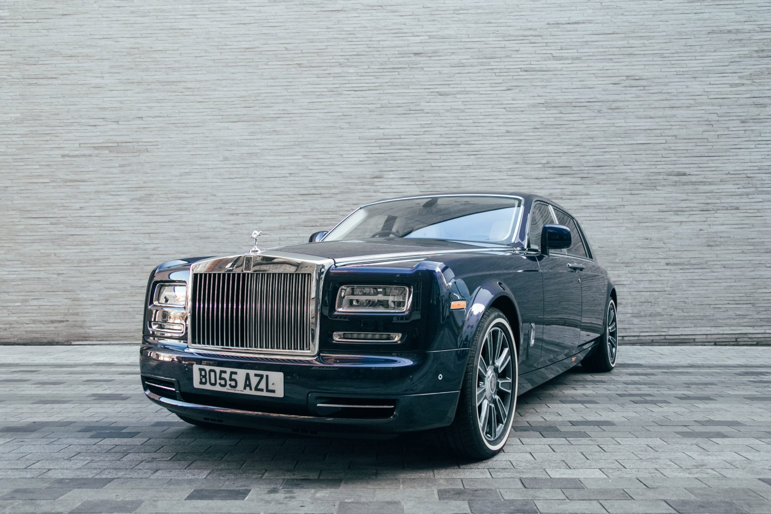 Front diagonal view of AZ Luxe's dark indigo Rolls Royce Phantom