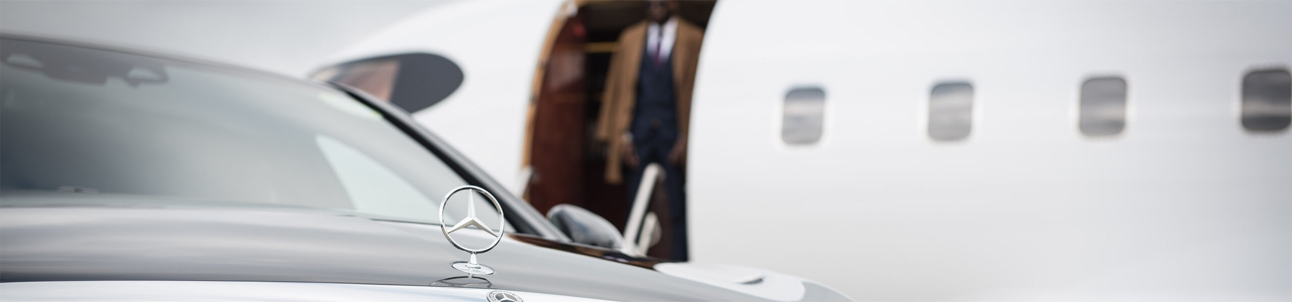 AZ Luxe's Mercedes Benz S Class waiting at Heathrow Airport for luxury transfer