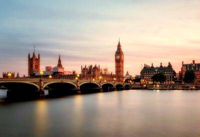 Illuminated view of Thames River, London Bridge, and Big Ben, highlighting AZ Luxe's concierge service area
