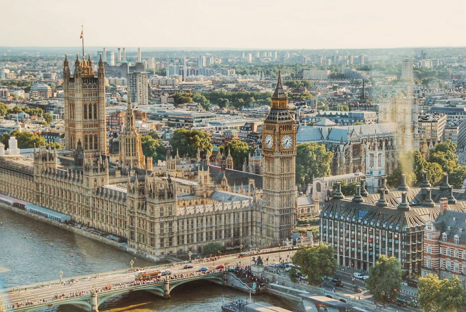 Bird's-eye view of London showcasing landmarks like London Bridge and Big Ben, areas served by AZ Luxe transfers