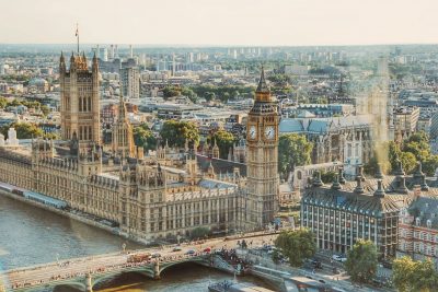 Bird's-eye view of London showcasing landmarks like London Bridge and Big Ben, areas served by AZ Luxe transfers