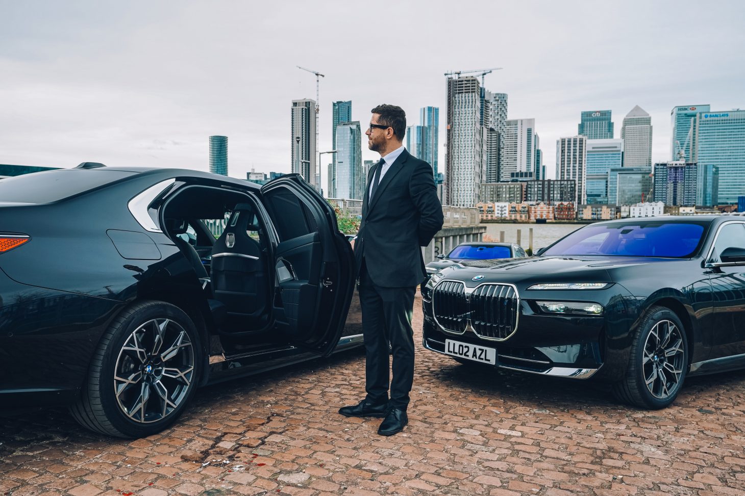 AZ Luxe's two BMW i7 electric cars with chauffeur for Heathrow transfers