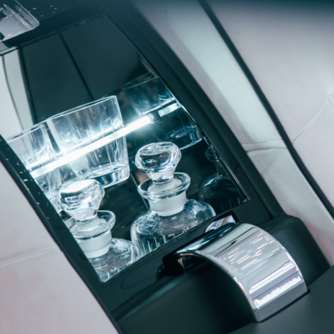 Built-in cooling cabinet stocked with drinks in AZ Luxe's Mercedes Benz S Class