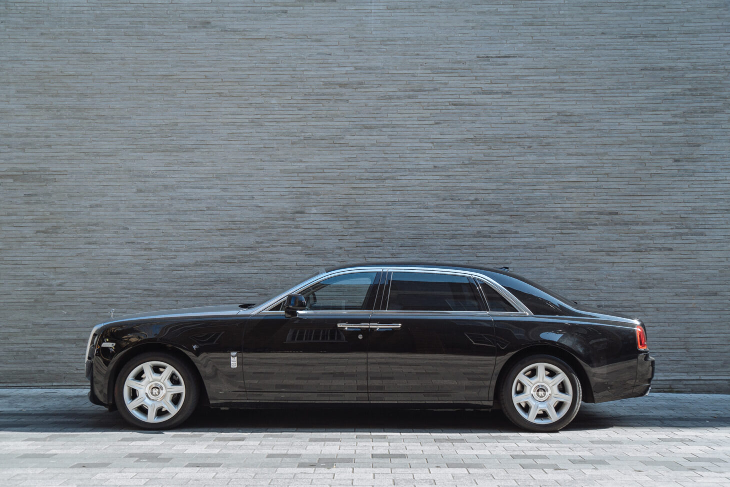 Side profile of AZ Luxe's Rolls Royce Ghost, emphasizing elegant proportions