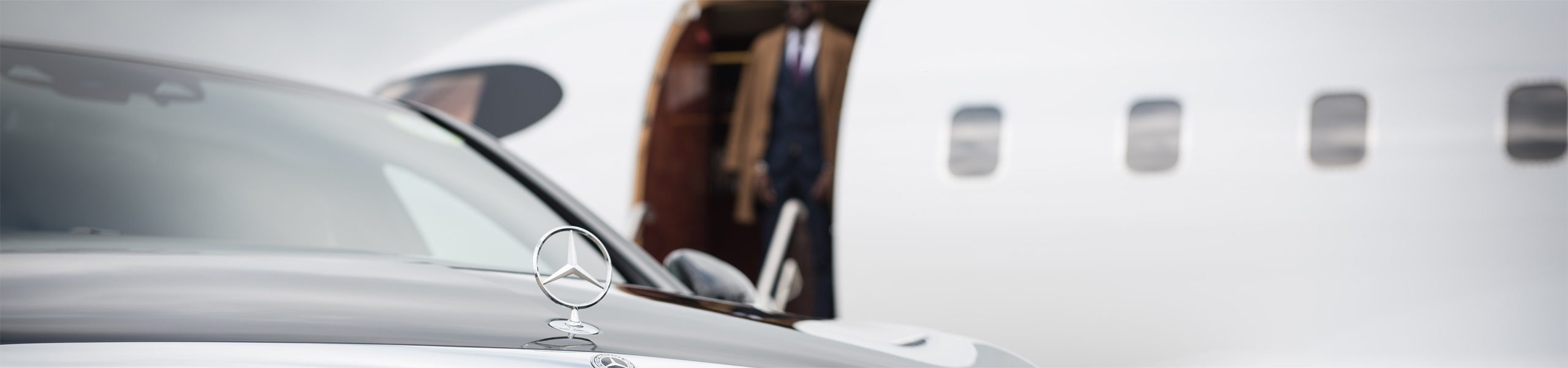 AZ Luxe's Mercedes Benz S Class waiting at Heathrow Airport for luxury transfer