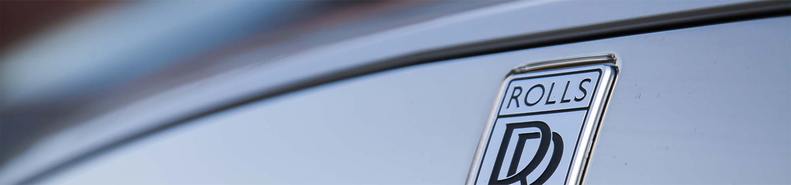 Close-up of iconic Spirit of Ecstasy emblem on AZ Luxe's Rolls Royce chauffeur car